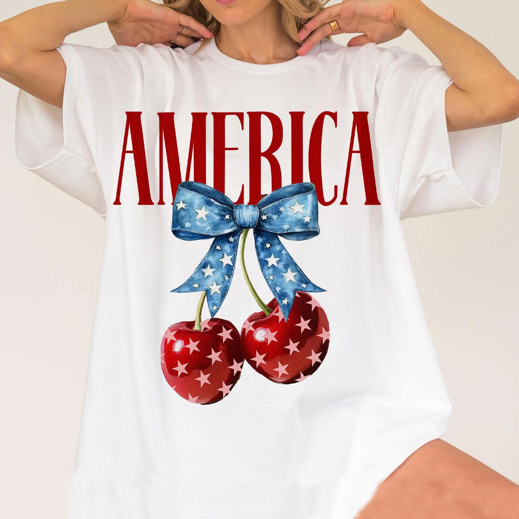 America Cherries T-Shirt, Cherry Bow 4th of July Shirt, Trendy July 4th Shirt, USA Flag Shirt, Soft Cotton Patriotic Shirt for Women, Cute Independence Day Gift