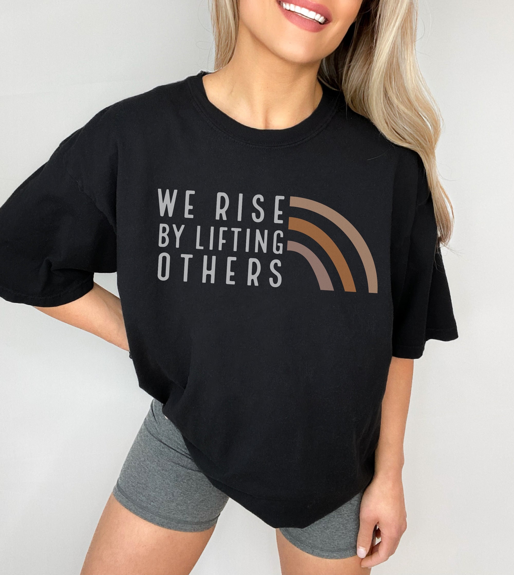 We Rise By Lifting Others Graphic Tee