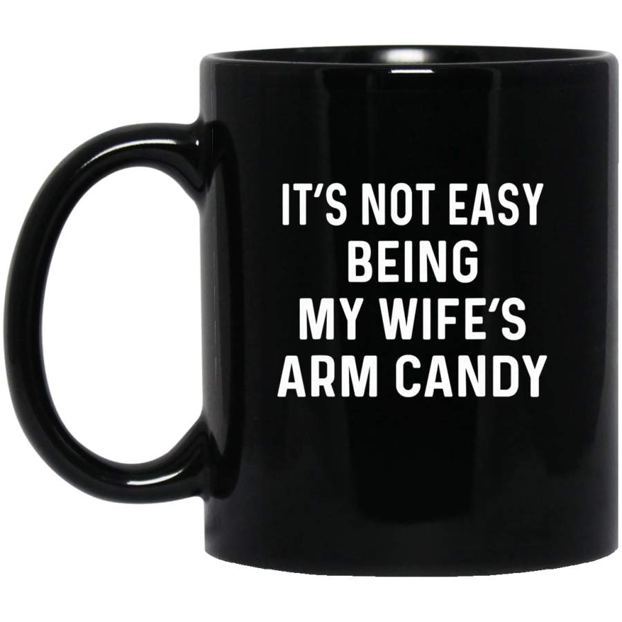 Mens It’s not easy being my wife’s arm candy Black Mugs