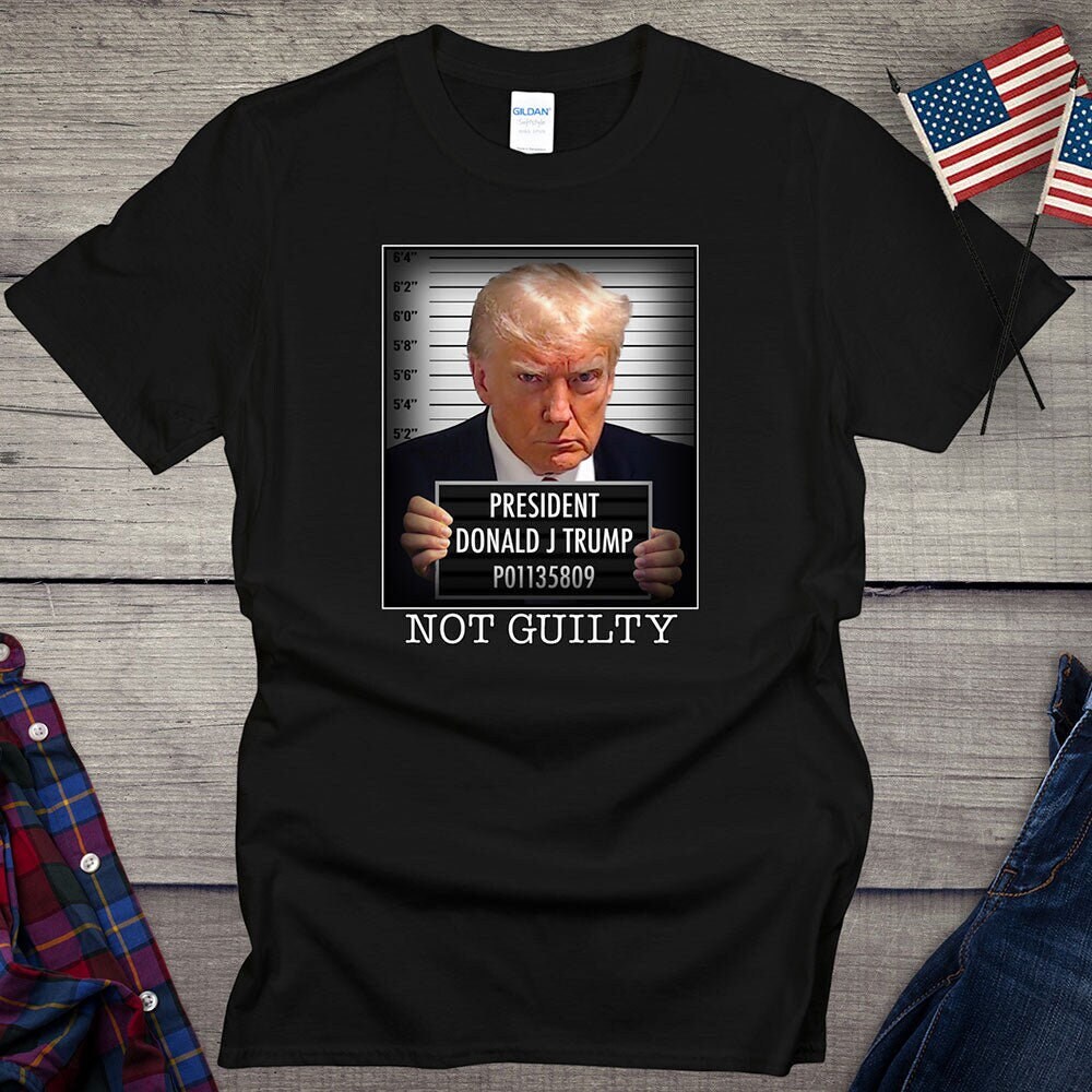 Donald Trump Mug Shot T-shirt, President Trump Not Guilty Tee, Free Trump Mugshot Shirt, Pro-Trump, Inmate, MAGA Free Trump Design By Sunrugs Fashion 2024