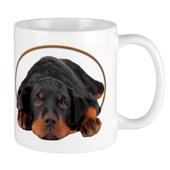 Sleeping Rottweiler Puppy In An Oval Circle Mug