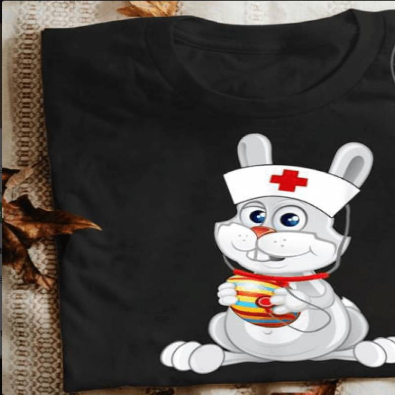 Cute Nurse Rabbit Easter Bunny Easter Rabbit With Stethoscope Easter Hare Bringing Easter Egg Adorable Gift For Nurse And Rabbit Lovers Black Men And Women T Shirt S-5Xl