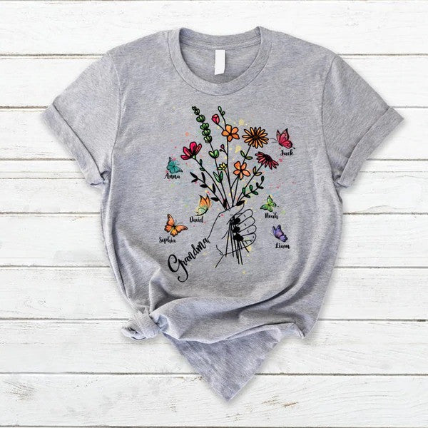 Customized Grandma Hands Holding Flower And Kids, Grandma’S Gift T Shirt