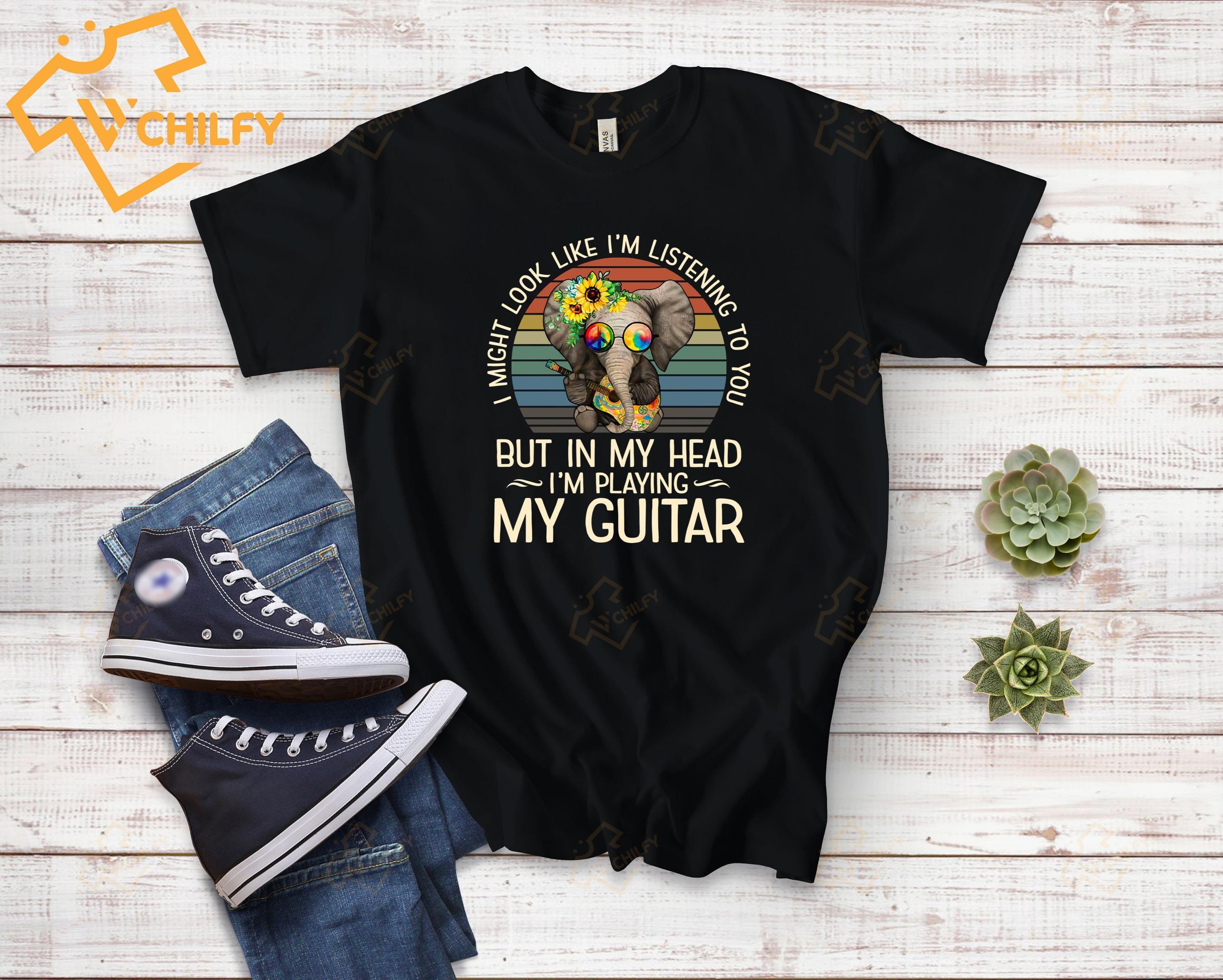 I might look like I’m listening to you in my head I’m pkaying my guitar, hippie shirt, guitar shirt