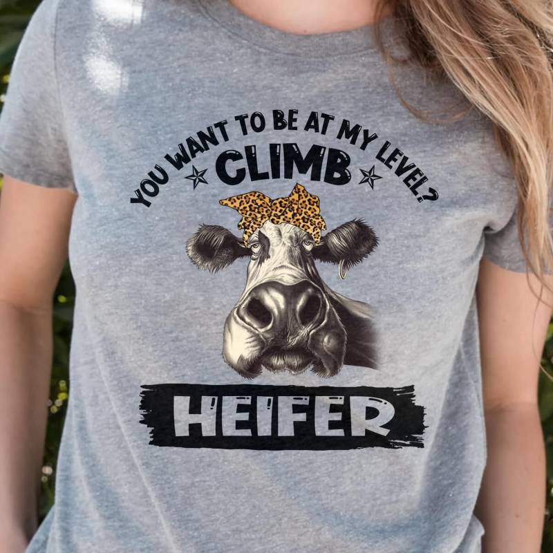 You Want To Be At My Level Climb Heifer Funny Looking Milk Cow With Leopard Fur Pattern Bow Headband Awesome Gift For Heifers Gray Men And Women T Shirt S-5Xl