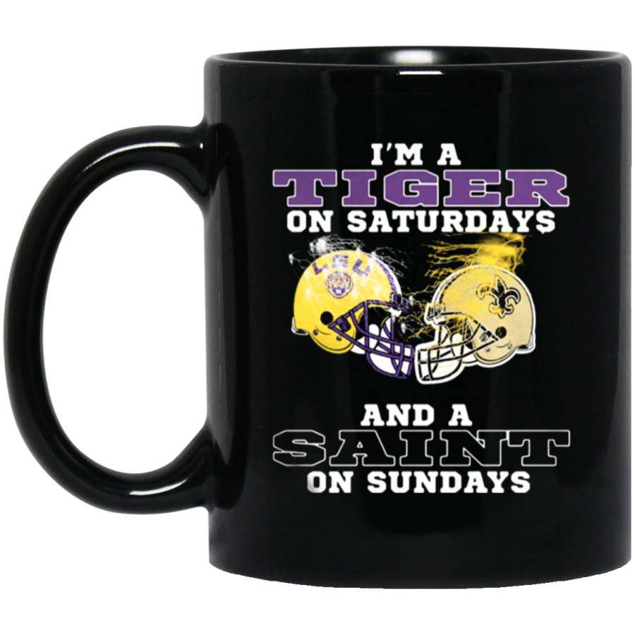 Awesome New Orleans Saints and Lsu tigers I’m a Tiger on Saturdays and a Saint on Sundays Mug 11 oz 15 oz Black Mug