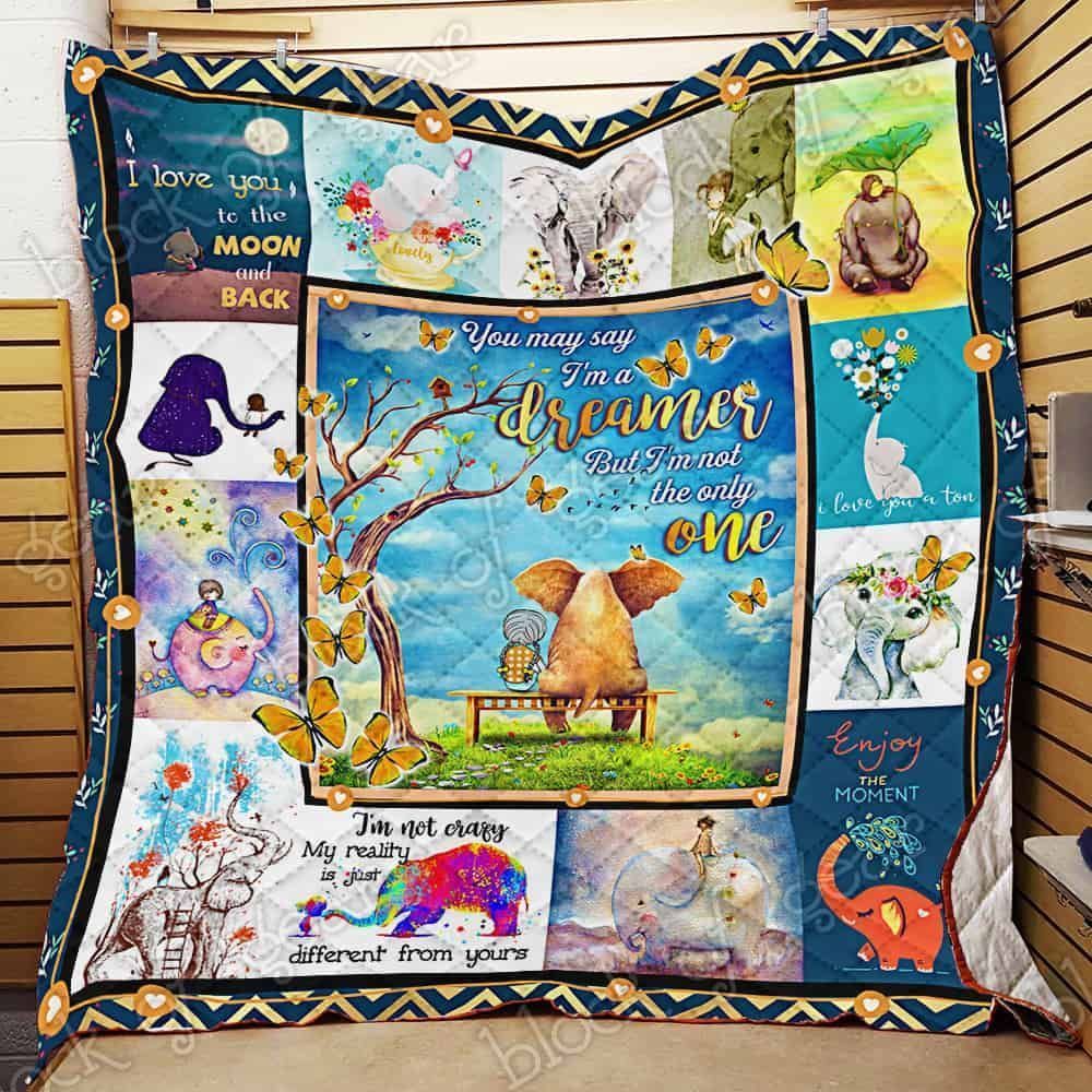 An Elephant Sitting On The Chair With A Girl  Quilt Blanket