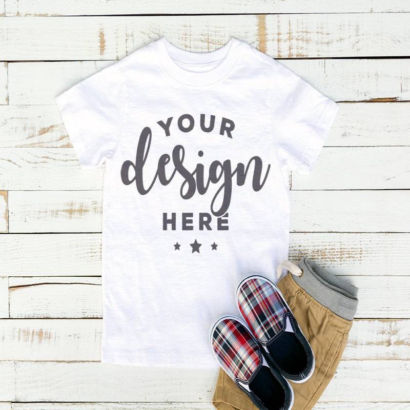 White Kids Tshirt Mockup On Distressed Wood White Background With Khaki Shorts and Plaid Shoes Hi Resolution Jpeg Image 300 ppi