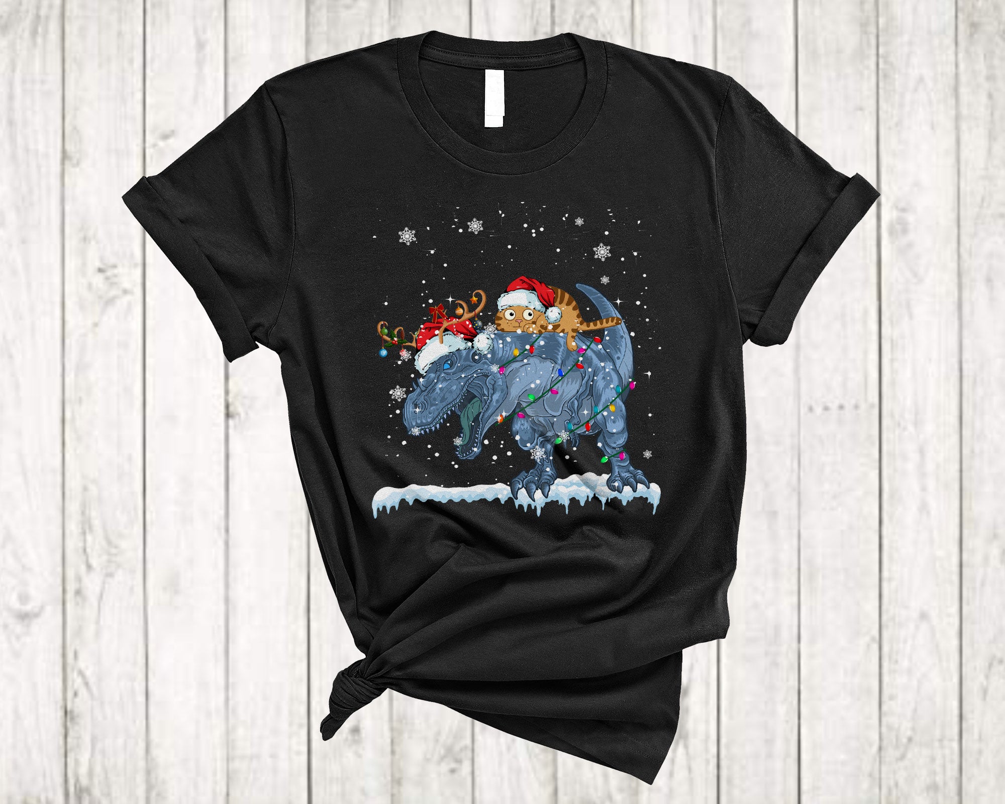 Cat Ridding T-Rex As Reindeer Funny Christmas Light Santa Cat T-Rex Dinosaur Lover T-Shirt