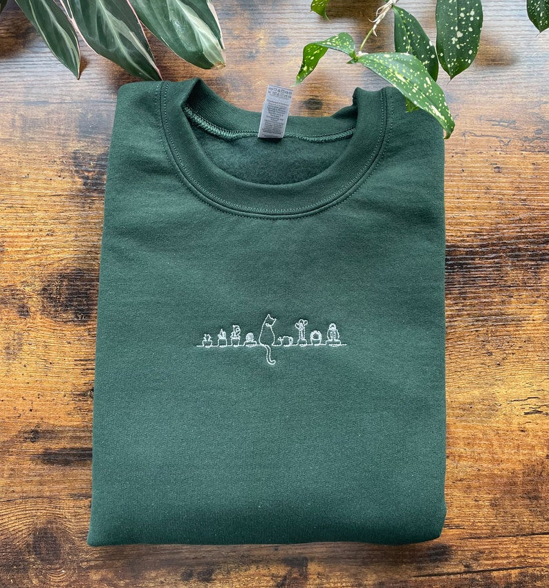 Cat Sitting On A Shelf With Plants Embroidered Sweatshirt 2D Crewneck Sweatshirt All Over Print Sweatshirt For Women Sweatshirt For Men Sws2915