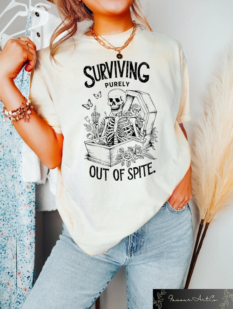 Surviving Purely Out Of Spite Comfort Shirt, Funny Goth Celestial Skeleton and Bats Shirt, Bat Lover Gothic Boho Tshirt, Gift for Men and Women, Full Size
